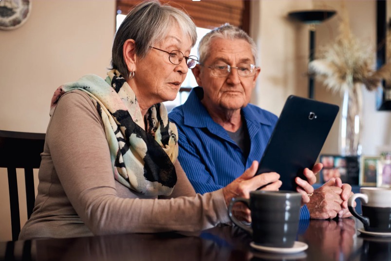 Caregiver helping an older adult with daily living activities